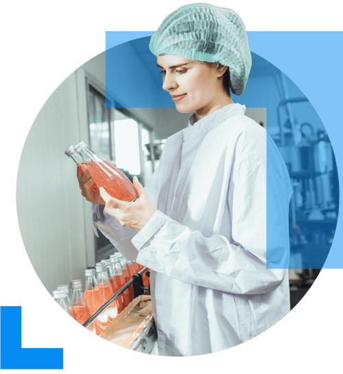 An individual working within the food and beverage industry inpects a product from a production line.